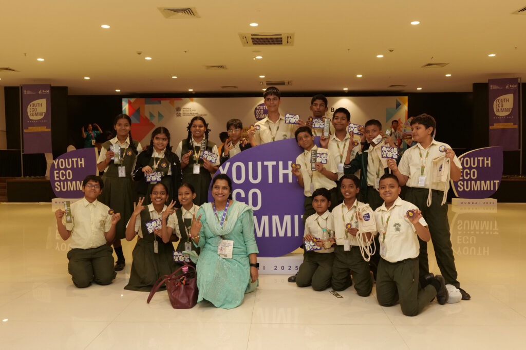 Students and a teacher celebrating together at Youth Eco Summit Mumbai 2025